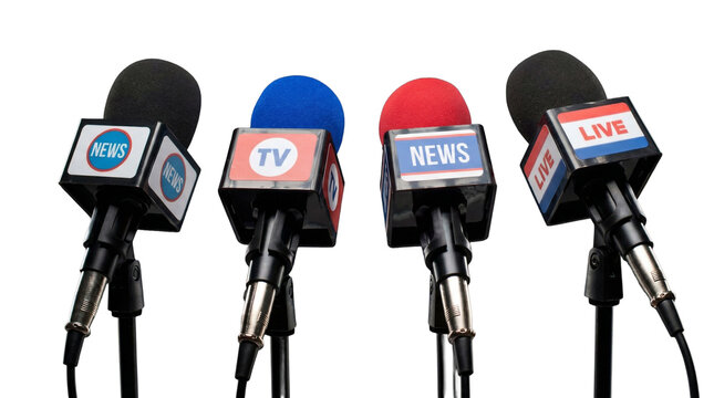 Microphones at press conference on black background