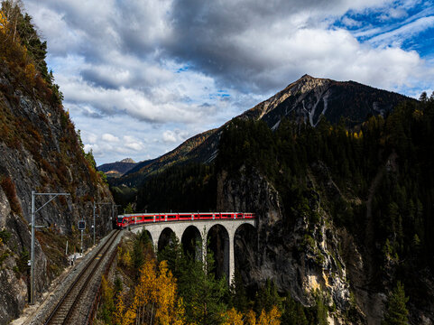 Red Bernina Express train on Landwasser viaduct