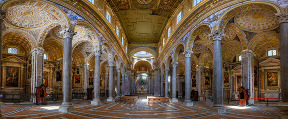 Obraz premium Naples, Italy. Girolamini Church (Chiesa dei Girolamini), featuring a spectacular golden coffered ceiling and marble columns.