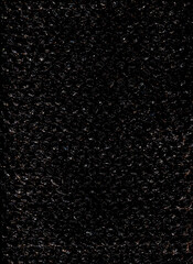 High contrast bubble wrap texture on black background with glowing light reflections. Abstract plastic pattern, futuristic industrial surface, dramatic lighting, creative packaging concept.