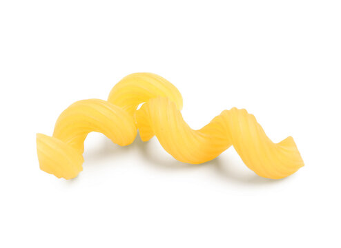 Uncooked cellentani pasta isolated on white background, closeup