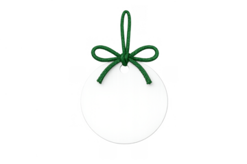 White round blank price tag and gift label with green string and bow for holiday sales and marketing