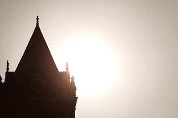 Old european building silhouette at sunset golden hour