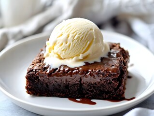 Decadent chocolate brownie with creamy vanilla ice cream
