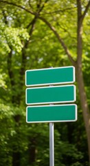 Three Green Directional Signs on a Pole in a Forest