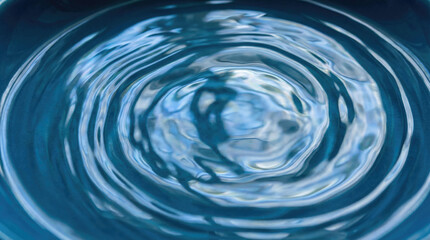 Calm water surface with reflecting light creates serene atmosphere