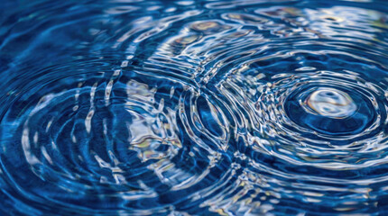Rippling water surface creates mesmerizing patterns and reflections in blue tones