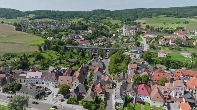 Aerial view of old viaduct in Emmersdorf in Wachau valley Austria. Beautiful architecture of old touristic historical railway bridge in the city.