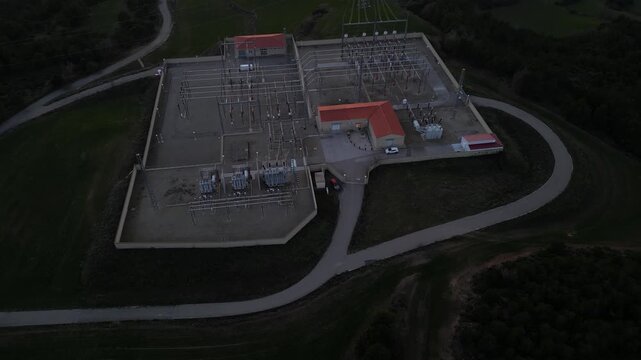 High-voltage electrical substation with transformers and power lines