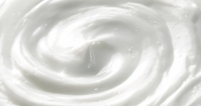 Cosmetic smears of creamy texture. Cosmetic skin cream. Beauty skincare product sample. Close-up footage of cream texture on rotating table