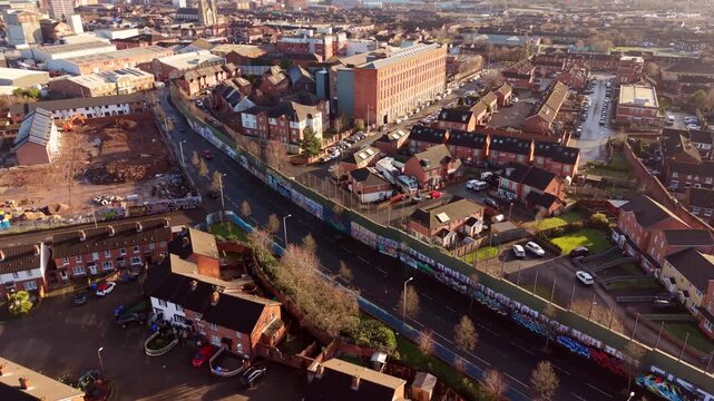 Overhead rotating 4K 60FPS aerial video of the Belfast Peace Wall Interface in Belfast, Northern Ireland. The murals explore the politics of NI and worldwide. Produced with Rec709 color.