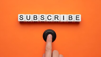 Hand pressing a black button with subscribe spelled out in letter blocks above