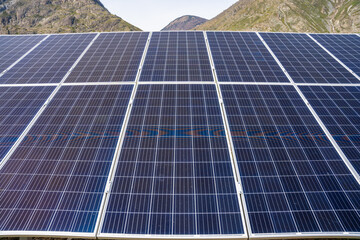 Close up of solar panels under bright sunlight with visible sun glare in Altai Russia Renewable energy technology in clean natural environment