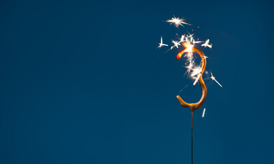 3 years celebration festive background with copy space made with Bengal fire in the form of number Three.