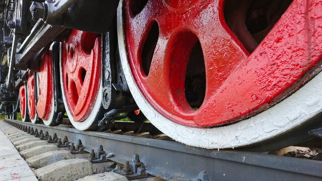 The undercarriage of an old steam locomotive