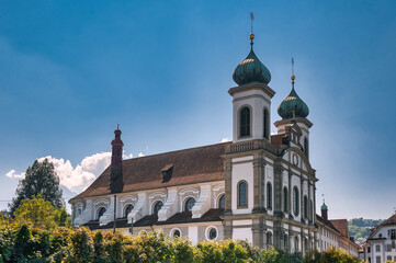 Lucerne, a compact Swiss city known for its well-preserved medieval architecture, is located amidst the snow-capped mountains of Lake Lucerne.