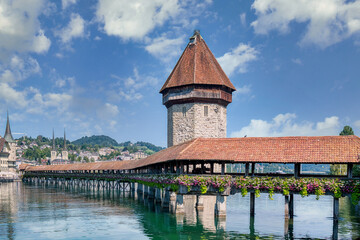 Lucerne, a compact Swiss city known for its well-preserved medieval architecture, is located amidst the snow-capped mountains of Lake Lucerne.