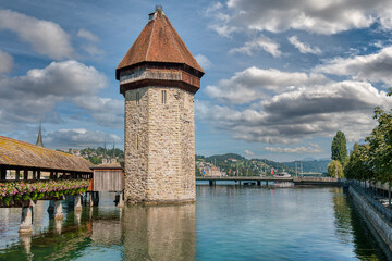 Lucerne, a compact Swiss city known for its well-preserved medieval architecture, is located amidst the snow-capped mountains of Lake Lucerne.
