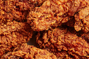 Close-up Macro View of Crispy Deep-Fried Chicken Tenders Background Texture © ShapeImages
