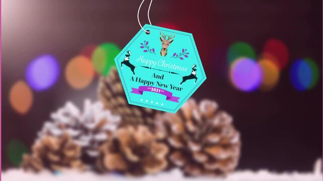 A pine cone decoration on fake snow during christmas time