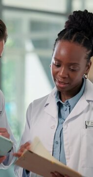 Hospital, doctors and team with tablet, meeting and medical research for treatment plan or services. Clinic, healthcare workers and collaboration with diagnosis report, discussion or people with tech