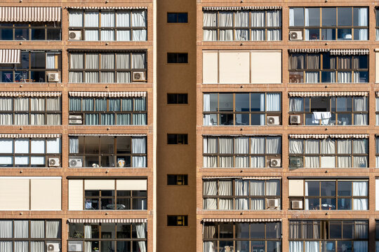 benidorm spain urban building facade with apartment residential windows in grid architecture style captured as vintage documentary city exterior