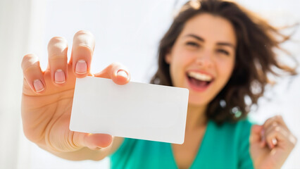 A smiling woman holding a blank white card mockup, perfect for inserting lottery ticket designs or marketing messages.