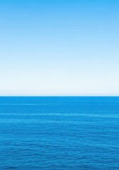 Obraz premium Wide angle view of the vast blue ocean meeting the clear sky at the distant horizontal line during the bright daytime hours, clear, expanse, environment