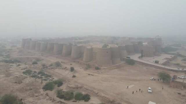An aerial view of the Derawar Fort, captured with a descending drone before the boundary of Fort. 4K Drone Video. 