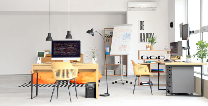 Interior of light programmer's office with desks and beanbags