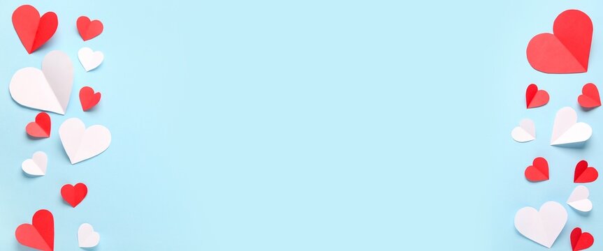Different paper hearts on blue background with space for text. Valentine's Day celebration