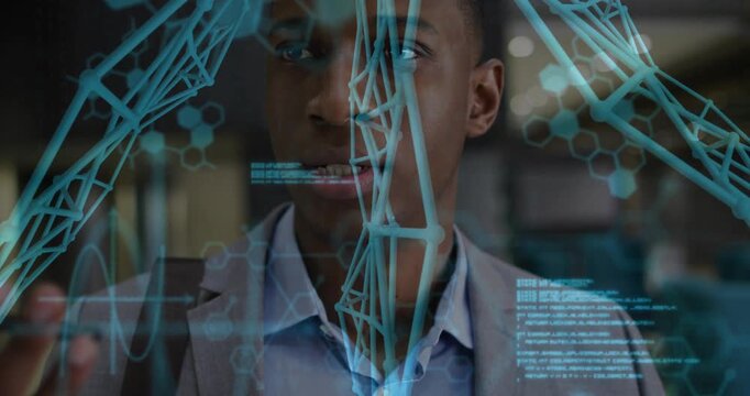 Mid adult man analyzing technology interface in lab, showing floating molecules and graphs