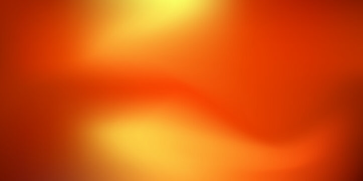 A warm yellow gradient background with sunset hues from yellow to red. The smooth color transitions are reminiscent of a warm autumn sky with a soft. Blurred sunset background. Vector illustration.