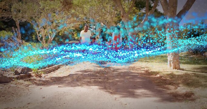 Family strolling path pausing as animated blue tech particle ribbon sweeps overhead before resuming