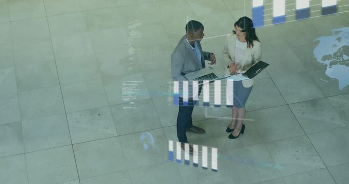 Man gesturing with laptop, woman noting, activating biz bar chart and globe overlays between them
