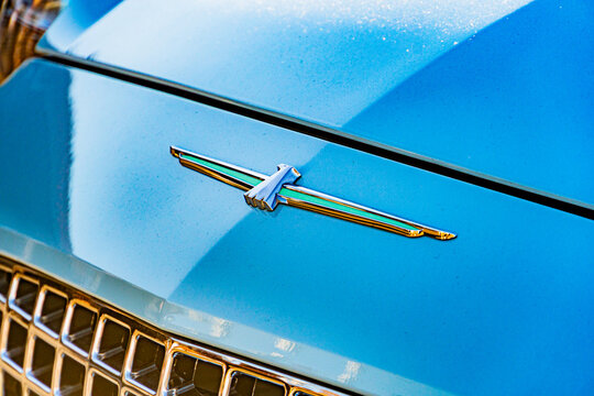 Blue Ford Thunderbird from rear-three quarter angle, emblematic grille with eagle figure, round headlights, chrome bumper, bright lighting, soft shadows - Kyiv, Ukraine - September 21, 2025