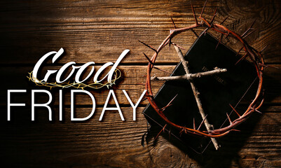 Crown of thorns with Bible and cross on wooden background