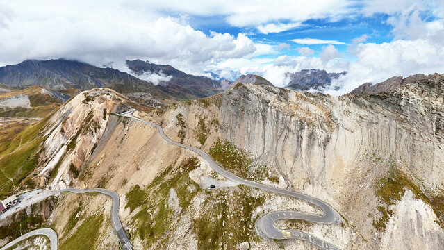 Col du Galibier pass with winding road and breathtaking alpine terrain, Savoie, Auvergne-Rhone-Alpes, France, Europe.