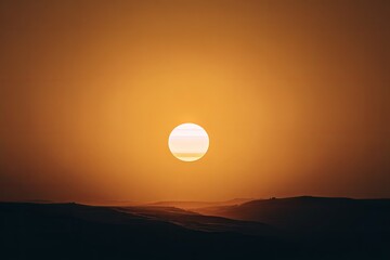 A mesmerizing landscape features a vibrant sunset casting an orange glow over distant hills