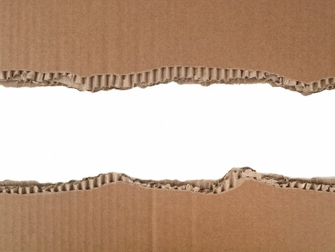 Ripped and torn brown corrugated cardboard border on white background. Perfect for recycled, eco-friendly, or industrial design concept