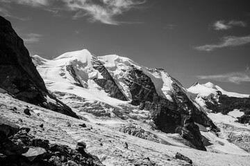 Piz Palu towers majestically alongside the Pers Glacier in the Bernina Range, showcasing the...