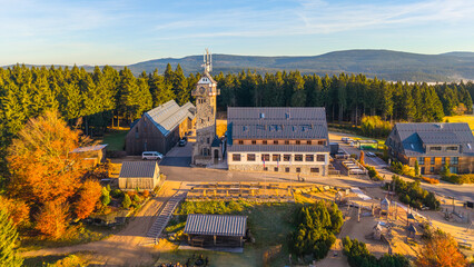 Kralovka Lookout Tower stands proudly in the Jizera Mountains. Surrounded by vibrant autumn...