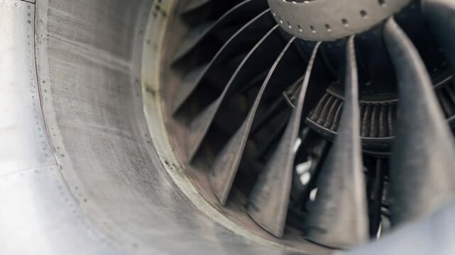 Close view of an aircraft engine turbine blades showing details of design and structure