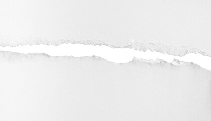 Horizontal ripped white paper tear line with rough edges, isolated on transparent background.