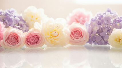 Soft Pastel Floral Arrangement Featuring Pink Roses White Peonies and Purple Hydrangeas on Reflective Surface Under Bright Lighting Creates a Delicate and Elegant Composition