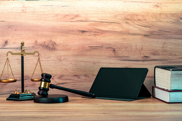 Business card template for advocacy, jurisprudence. A judicial courtroom with a judge's gavel, scales of justice, law books, tablet. Court decisions, judicial fairness