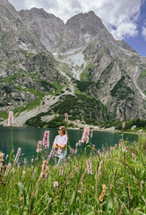 girl on the mountain lake, summer green mountain walking 