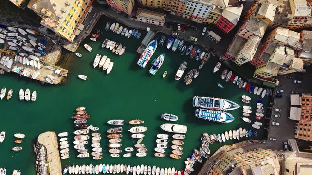 Drone Flyover of Camogli Harbor and Traditional Colorful boats and Buildings, Italy