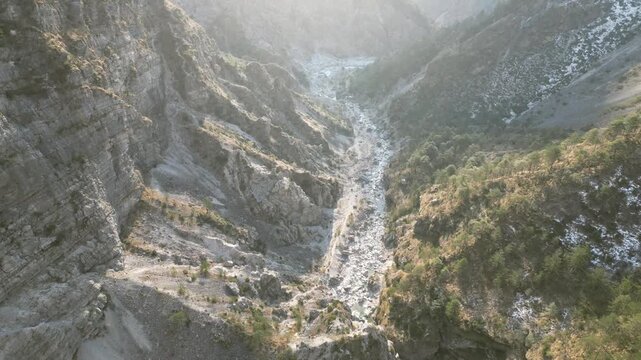 Aerial drone footage over the Susaibes stream near Andreis, Italy: clear water, rocky bed and pristine alpine surroundings. Ideal for nature, travel and scenic stock footage.