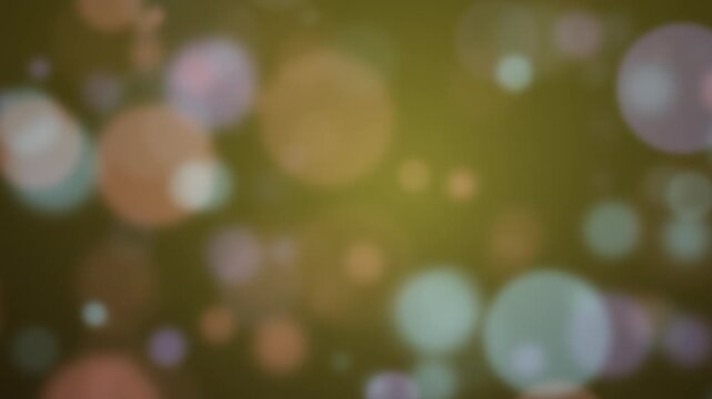 Colorful bokeh lights create a dreamy, blurred green background